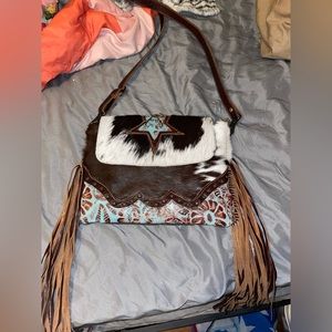Cow print fringe purse
